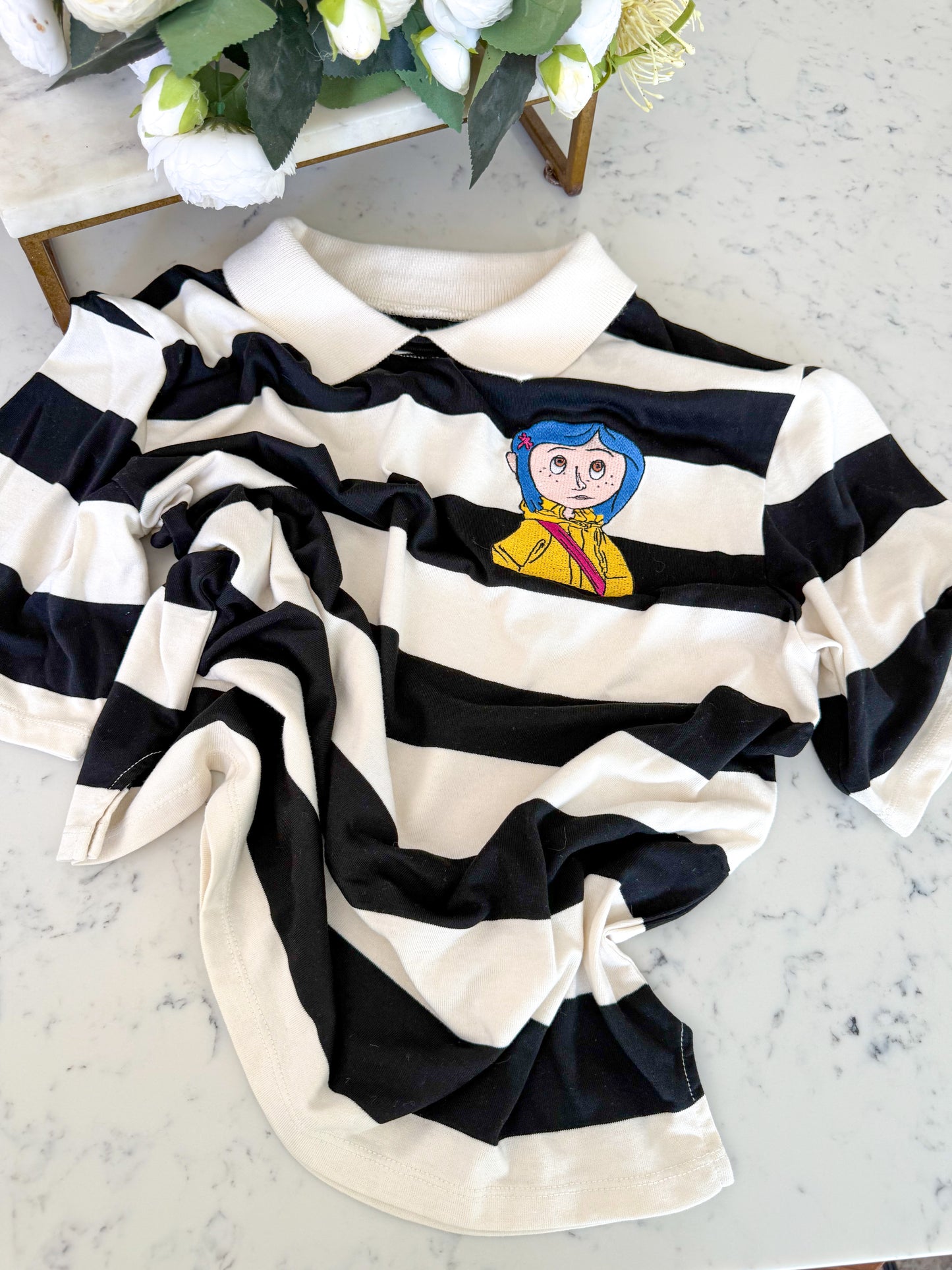 BUTTON EYES EMBROIDERED POLO SHIRT