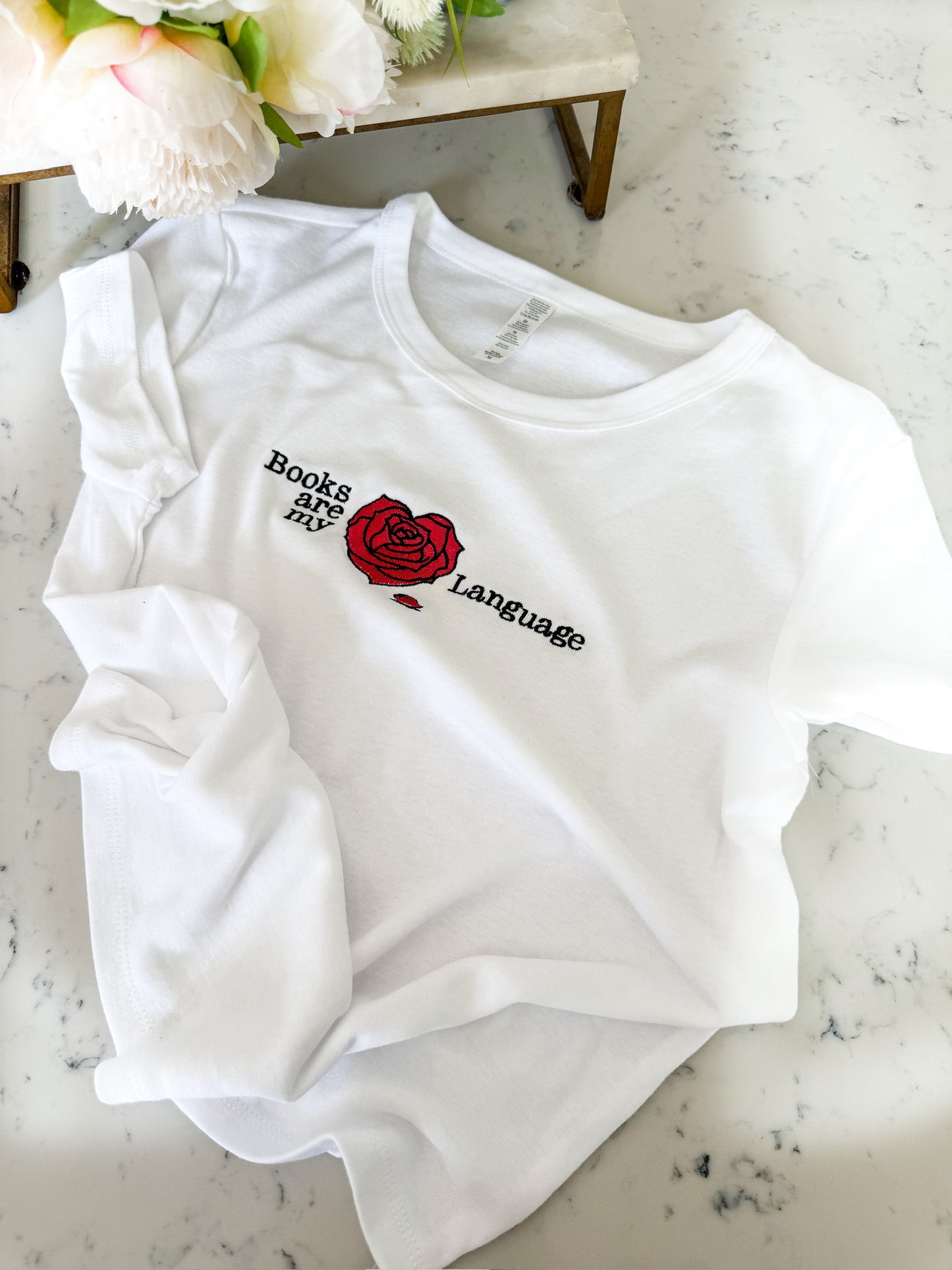 BELLE’S BOOKS ARE MY LOVE LANGUAGE EMBROIDERED BABY TEE